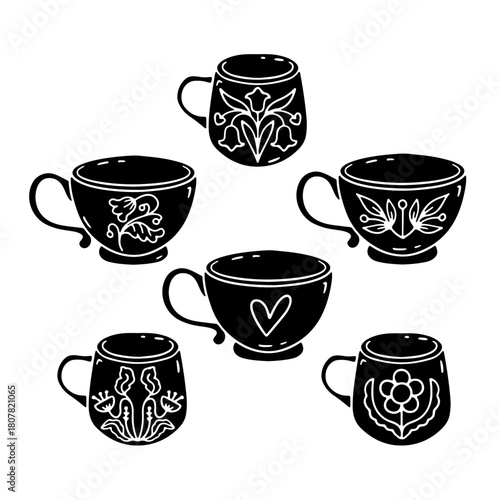 Set of hand drawn hygge coffee or tea decorated mugs silhouette icons