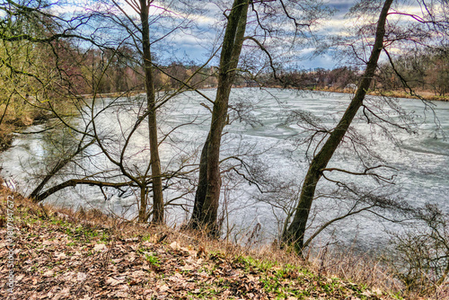 a pond on the Cybina River route covered with ice during winter
