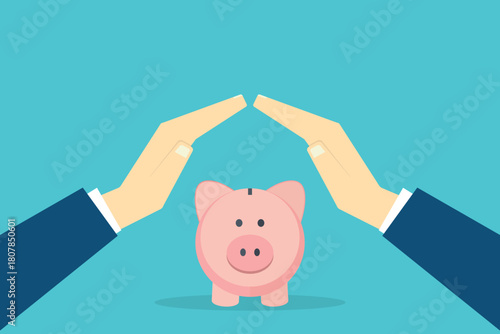 Hands protecting piggy bank, savings concept