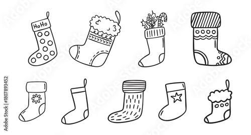 Christmas stockings line art clipart set with festive socks for gifts and fireplace hanging, monochrome holiday collection, hand drawn.
