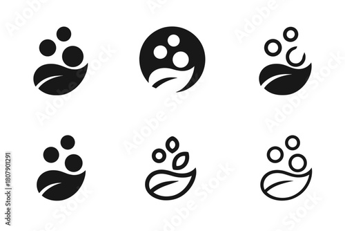 Eco-Friendly Cleaning Logos. Non-toxic household cleaning solutions. Icon set. Set Logo of Non-toxic household cleaning solutions: soap bubbles and leaf.