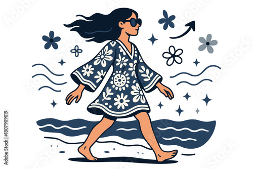 Boho Beach Stroll. A young woman wearing a boho-chic dress and oversized sunglasses. Side view of woman walking along beach wearing boho dress and sunglasses;