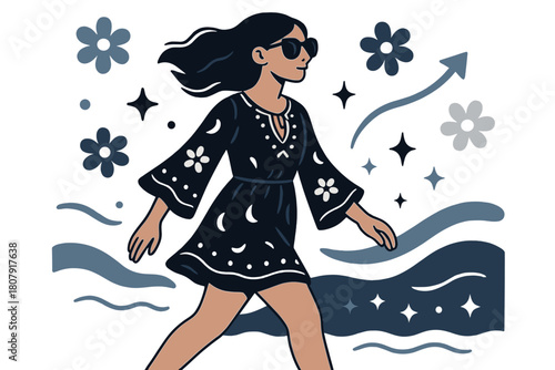 Boho Beach Stroll. A young woman wearing a boho-chic dress and oversized sunglasses. Side view of woman walking along beach wearing boho dress and sunglasses;