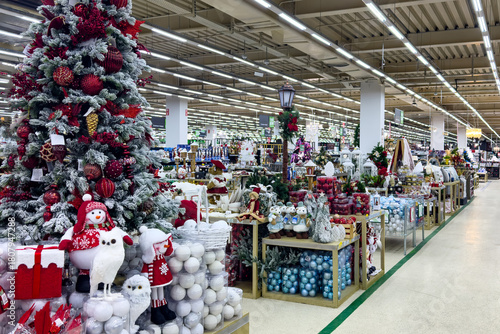 Preparation for Christmas and New year winter holiday concept. Sale of Christmas decorations in shopping mall. Store of Christmas symbols and accessories.