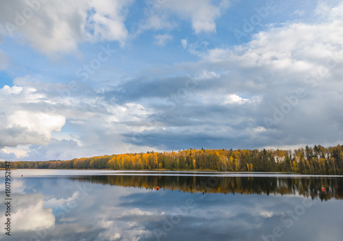 Lake with a cloudy sky in the background