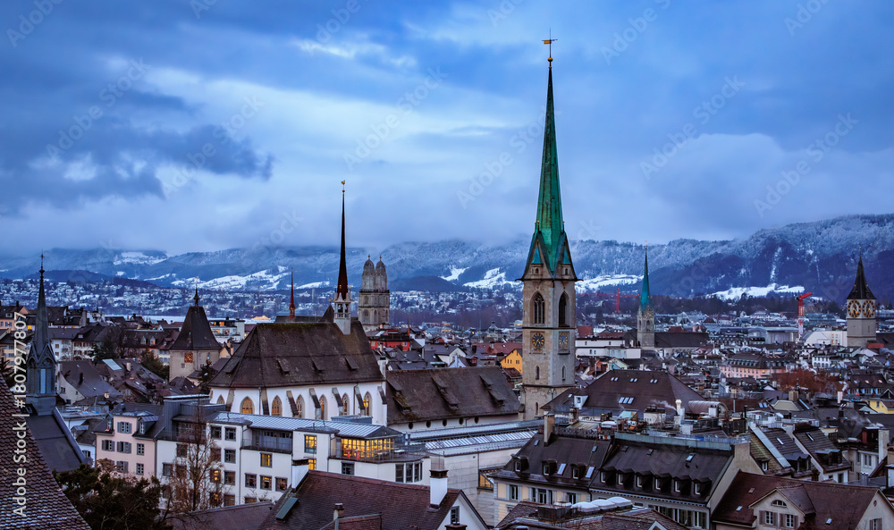 Naklejka premium Winter cityscape with church towers after a snowfall in Zurich, Switzerland