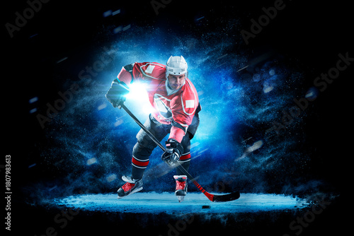 Hockey. Hockey players on a beautiful black background with a flash of light behind them. Isolated on a black background. Sports