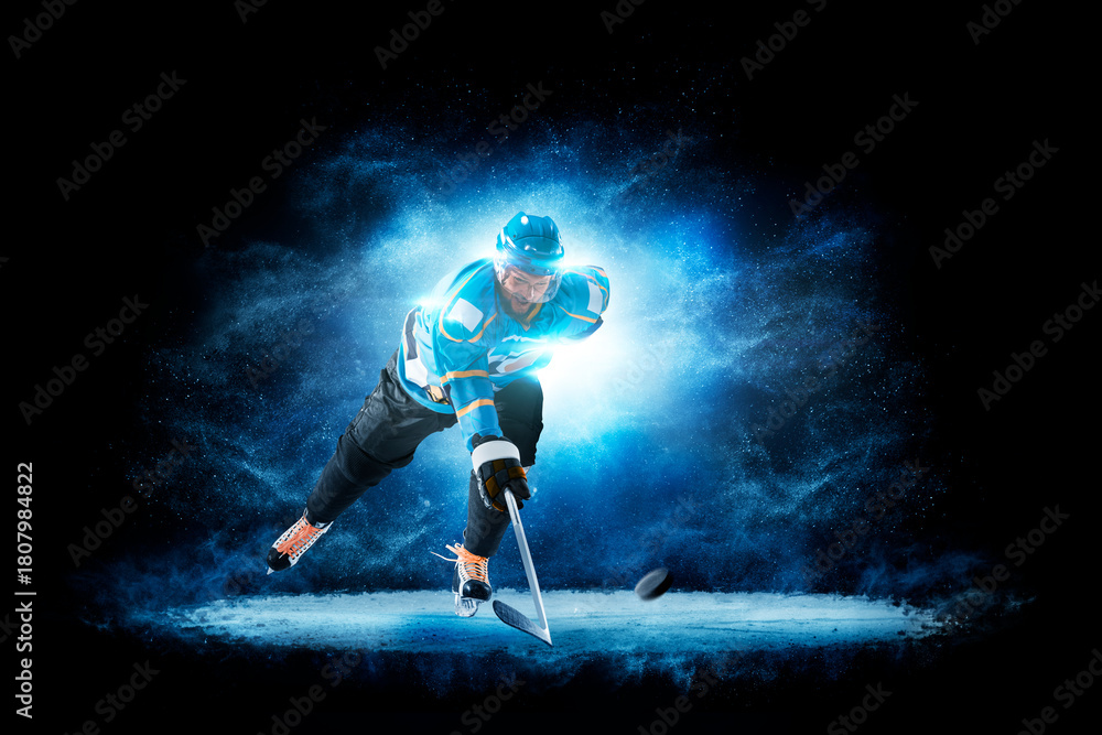 Naklejka premium Hockey. Hockey players on a beautiful black background with a flash of light behind them. Isolated on a black background. Sports
