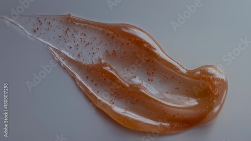 Close-up of Orange Scrub Swirl on White Background for Beauty and Cosmetic Products Presentation