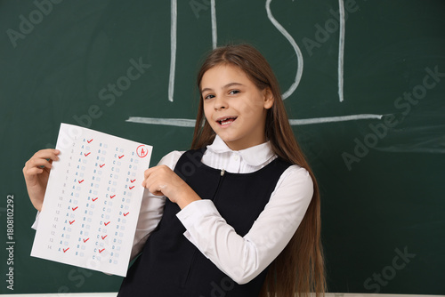 Happy schoolgirl with resul...