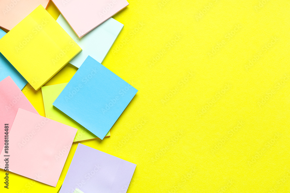 Fototapeta premium Different blank sticky notes on yellow background