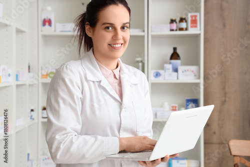 Female pharmacist working w...