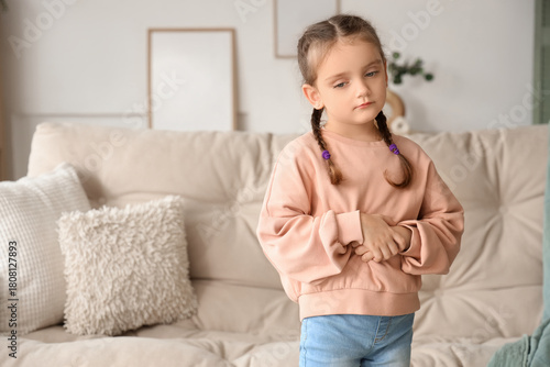 Little girl with stomachach...