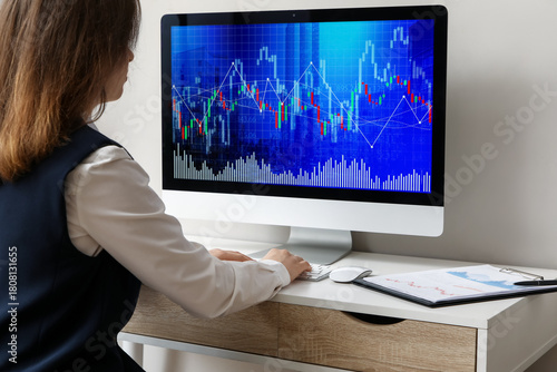 Female trader working with ...
