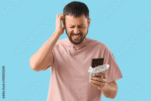 Young man with chocolate ba...