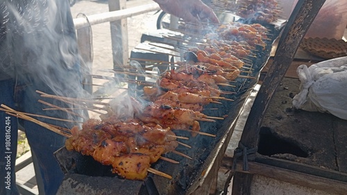 Traditional Sate Ayam being Cooked on Skewers | Smoking Barbecue of Indonesian Street Food | Marinated Chicken Skewers on a Grill