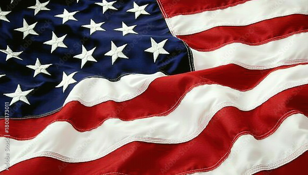 Obraz premium A close-up of the American flag, with its iconic red and white stripes and blue field adorned by bold stars, gently waving in the wind against an isolated background. The flag's intricate design