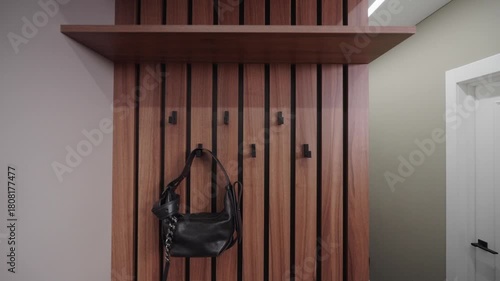 Camera Tracking Forward Revealing Wall with Coat Hooks