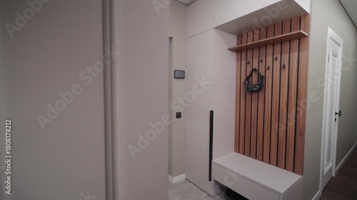 Camera Slider Pan from Left to Right Showing Entryway with Shoe Rack and Front Door