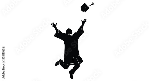 Silhouette of graduate throwing cap in the air