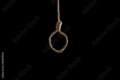 Fototapeta Hanging rope with loop on black background. Suicide concept