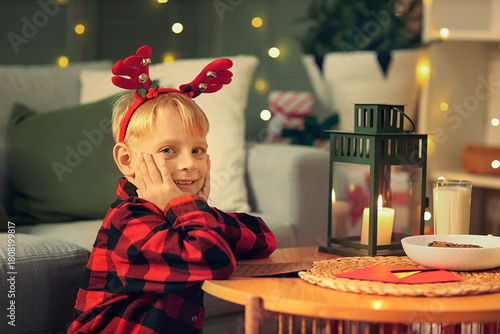 Little happy boy in checker...