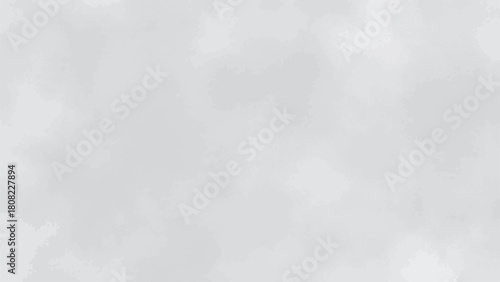 A softly textured gray background with indistinct shapes and subtle variations