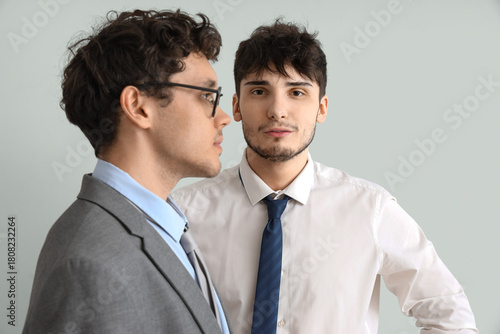Young brothers in suits on ...