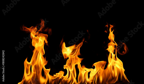 Bright orange fire flames on a black background create a dramatic and intense visual effect. Perfect for design, energy concepts, danger themes, or background use in advertising and digital art.
