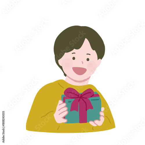 笑顔でギフトボックスを持っている小さな男の子