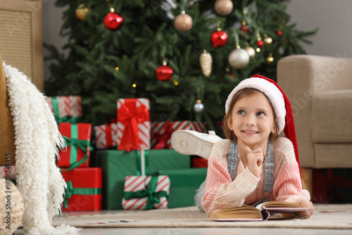 Dreamy little girl in Santa...