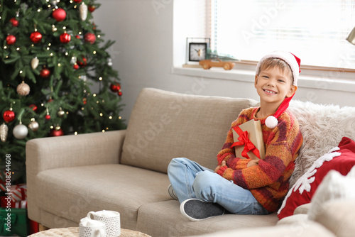 Cute little boy in Santa ha...