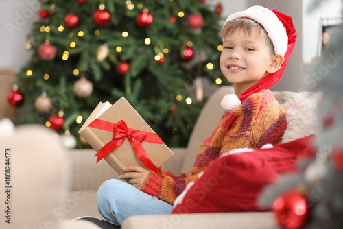 Cute little boy in Santa ha...