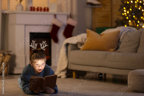Cute little boy reading Chr...