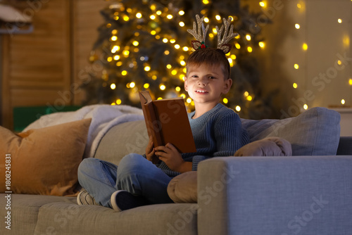 Cute little boy reading Chr...