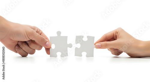Two hands connecting white puzzle pieces together