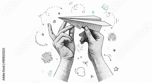Hands holding paper airplane with decorative elements.