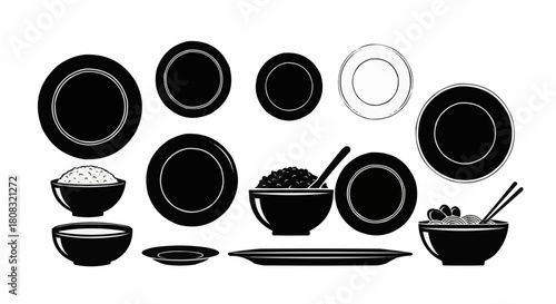 Collection of black plates bowls and dishes for serving food.