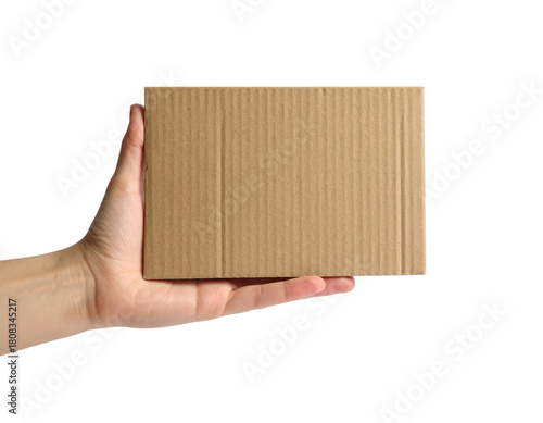 Stock photo of hand holding small cardboard box for shipping on transparent background