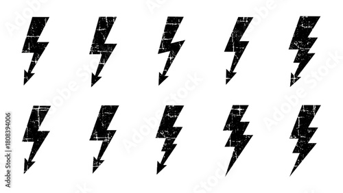 A collection of black grunge lightning bolt icons with a textured effect for design
