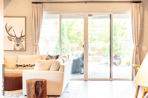 Spacious living room with sliding glass door to a lovely patio