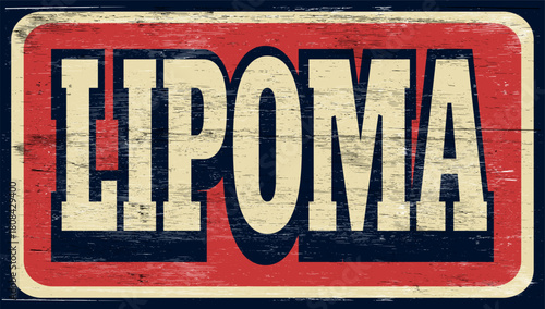 Aged and worn lipoma sign on wood