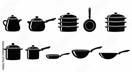 Collection of various black kitchen pots and pans for cooking.