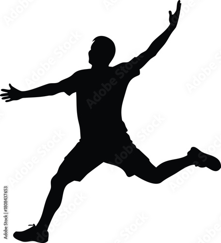 A silhouette of an athletic man joyfully jumping in a dynamic pose