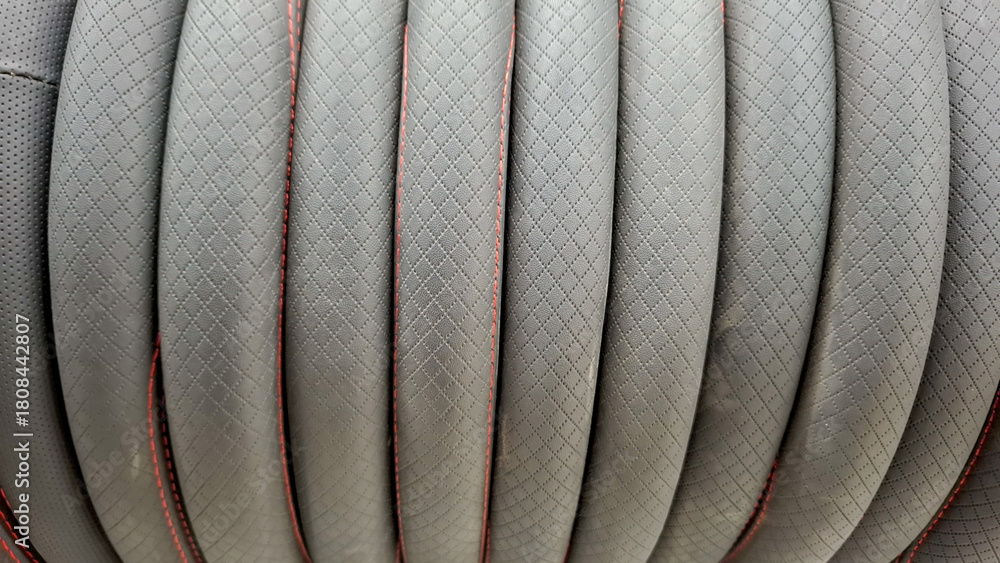 Fototapeta premium Luxury Grey Leather Car Seat with Diamond Stitching and Red Thread