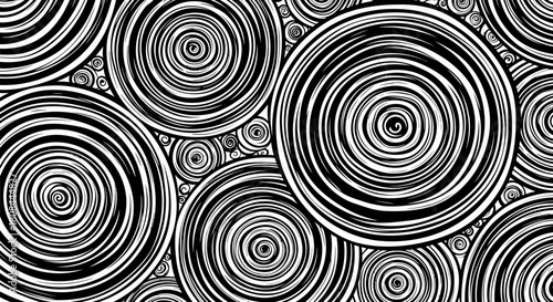 An abstract pattern of concentric circles in black and white, creating a visually hypnotic effect.