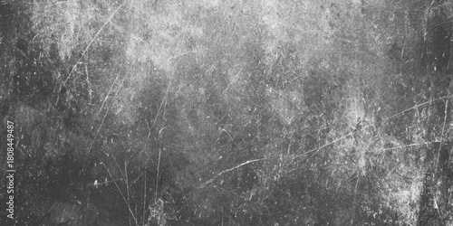 Old dark gray grunge texture background with heavy scratches dirt dust and distressed surface effect vintage industrial or film overlay.