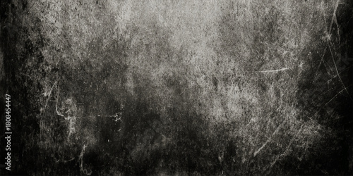 Abstract dark grunge texture with black and gray concrete wall and vignette effect details including scratches, cracks, peeling paint effects, dust particles.