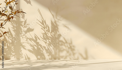 Minimalist warm beige background with natural leaf shadows and sunlit empty platform.