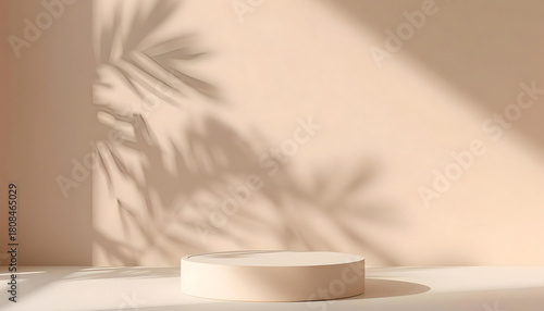 Minimalist round beige podium with natural palm leaf shadows on a warm wall background